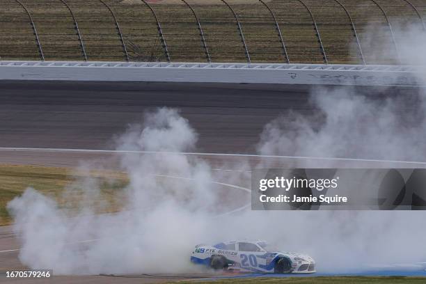 John Hunter Nemechek, driver of the Pye Barker Fire & Safety Toyota, celebrates with a burnout after winning the NASCAR Xfinity Series Kansas Lottery...