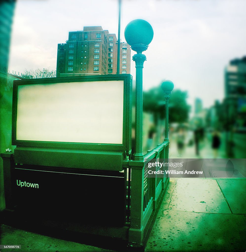 Subway entrance with white billboard