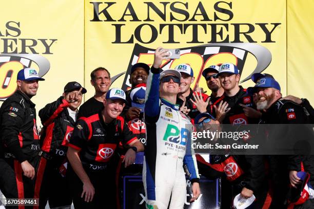 John Hunter Nemechek, driver of the Pye Barker Fire & Safety Toyota, and crew take a selfie in victory lane after winning the NASCAR Xfinity Series...