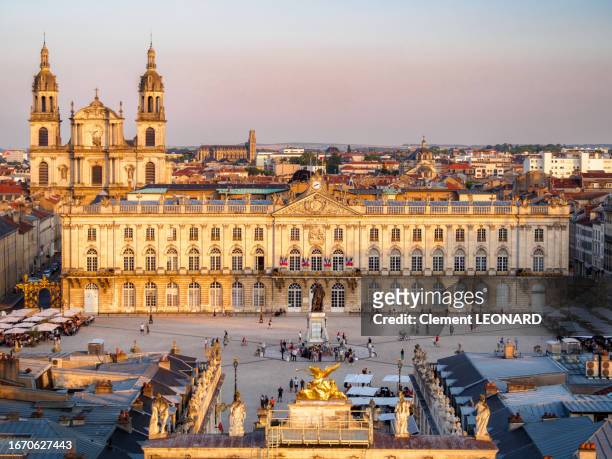 aerial view of the place stanislas (stanislaw square) with the top of the arc héré (here arch) in the foreground and the town hall and the stanislas statue in the middle, nancy, meurthe et moselle, lorraine, eastern france. - stanislas stock pictures, royalty-free photos & images