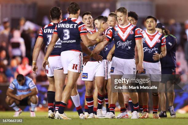 Roosters players celebrate victory during the NRL Elimination Final match between Cronulla Sharks and Sydney Roosters at PointsBet Stadium on...