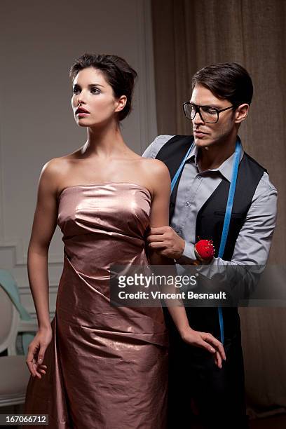 fitting a designer clothing - strapless evening gown stock pictures, royalty-free photos & images
