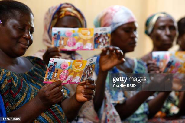 An African woman, Photo essay in Lome in Togo, West Africa. Meeting of information of the association Chain of hope on children sponsoring. Thanks to...