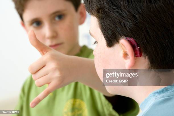 Boy Using Sign Language 350 R In Sign Language Stock Photos, High-Res Pictures, and Images ...