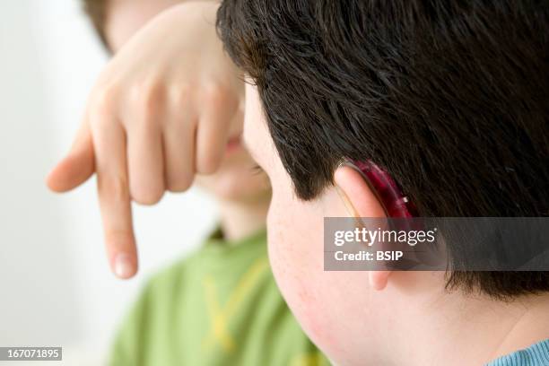 Boy Using Sign Language R In Sign Language Photos and Premium High Res Pictures - Getty Images