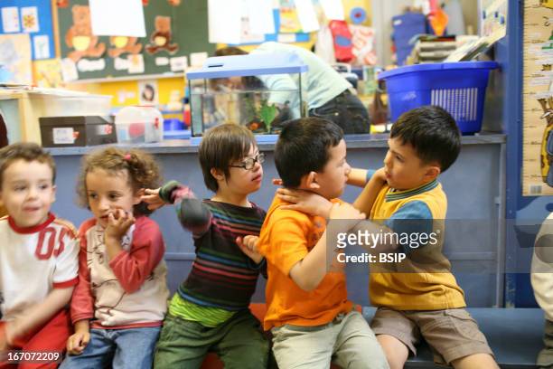 Child, down's syndrome at school, Louise, age 5, in kindergarten ordinary. Brussels. Photo by: BSIP / Universal Images Group via Getty Images