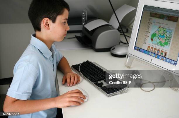 Computer Boy Instructor 24,940 Boy Learning On Computer Stock Photos, High-Res Pictures, and ...