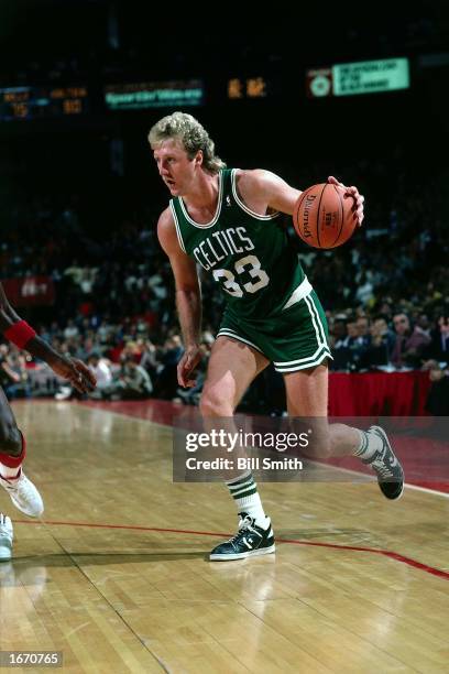 Larry Bird of the Boston Celtics drives during the 1980 NBA game against the Chicago Bulls at Chicago Stadium in Chicago, Illinois. NOTE TO USER:...