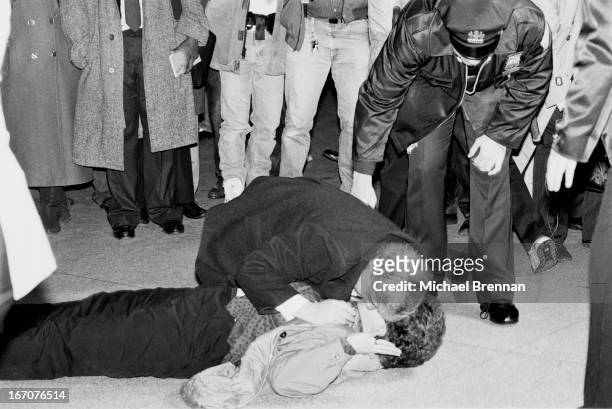Woman waiting at John F. Kennedy International Airport for Pan Am flight 103 collapses at hearing the news of the Lockerbie bombing, New York, 21st...