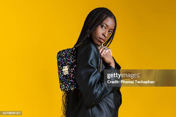 fashionable woman wearing smart casual outfit - bolso negro fotografías e imágenes de stock