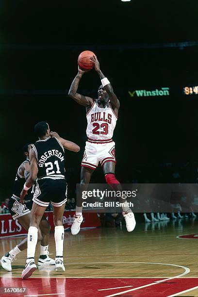 Michael Jordan of the Chicago Bulls takes a jumper during the 1985 NBA game against the San Antonio Spurs at Chicago Stadium in Chicago, Illinois....