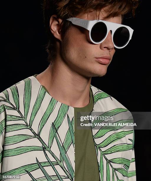 Models present creations by R.Groove during the 2014 Summer collections of the Rio Fashion Week in Rio de Janeiro, Brazil, on April 19, 2013. AFP...