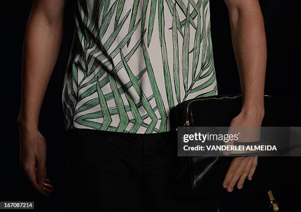 Models present creations by R.Groove during the 2014 Summer collections of the Rio Fashion Week in Rio de Janeiro, Brazil, on April 19, 2013. AFP...