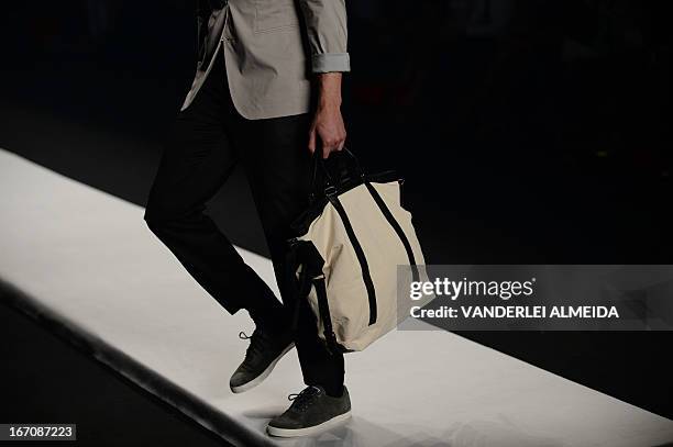 Models present creations by R.Groove during the 2014 Summer collections of the Rio Fashion Week in Rio de Janeiro, Brazil, on April 19, 2013. AFP...