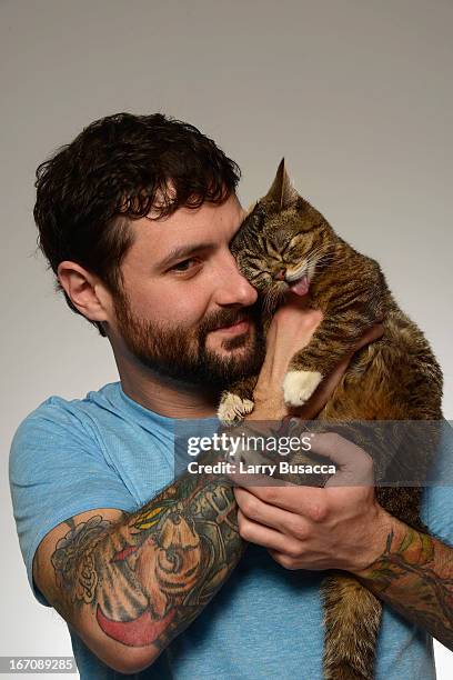 Mike Bridavsky poses with Lil Bub of the film "Lil Bub & Friendz" at the Tribeca Film Festival 2013 portrait studio on April 19, 2013 in New York...