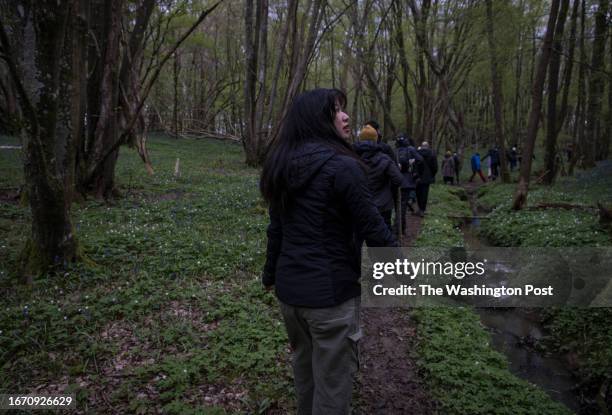 Joi Lee looks at the woods as he walks alongside a group of Black, Asian and Minority campers during an expedition out in nature organised by Climate...