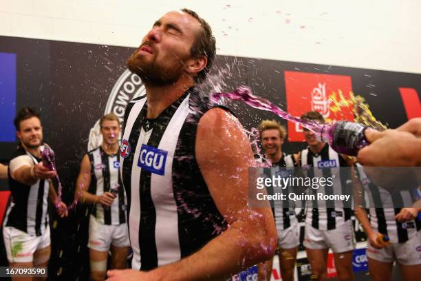 Ben Hudson of the Magpies is sprayed by drinks in the rooms after winning the round four AFL match between the Richmond Tigers and the Collingwood...