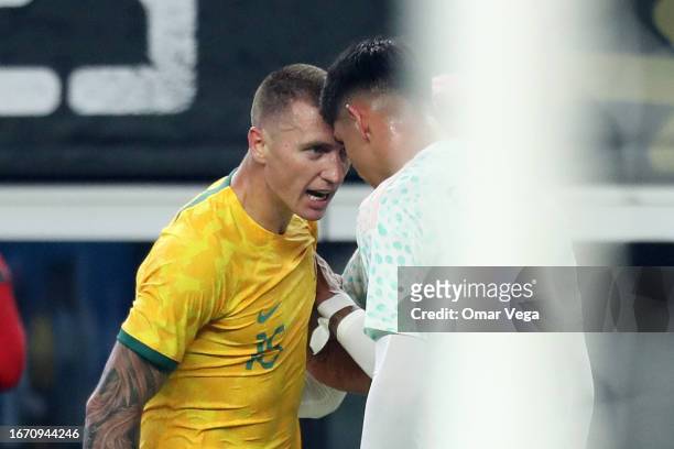 Mitchell Duke of Australia and Edson Alvarez Mexico argue during the friendly match between Mexico and Australia at AT&T Stadium on September 9, 2023...