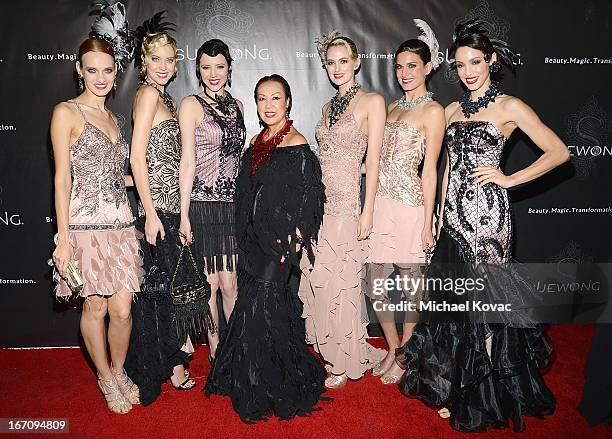 Designer Sue Wong poses with models at the Sue Wong Fall 2013 Great Gatsby Collection Unveiling and Birthday Celebration on April 19, 2013 in Los...