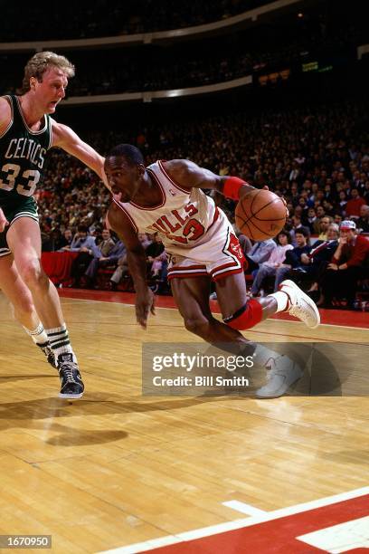 Michael Jordan of the Chicago Bulls drives to the basket during the 1985 NBA game against the Boston Celtics at Chicago Stadium in Chicago, Illinois....