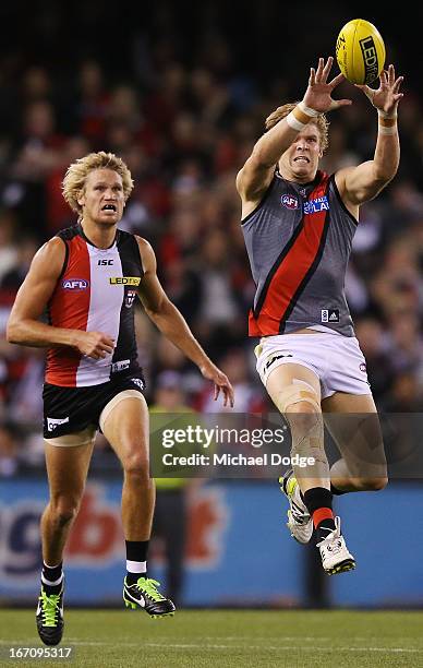 Michael Hurley of the Bombers marks the ball in front of Sam Gilbert of the Saints during the round four AFL match between the St Kilda Saints and...