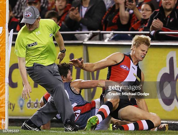Jake Carlisle of the Bombers and Nick Riewoldt of the Saints collided with this goal umpire during the round four AFL match between the St Kilda...