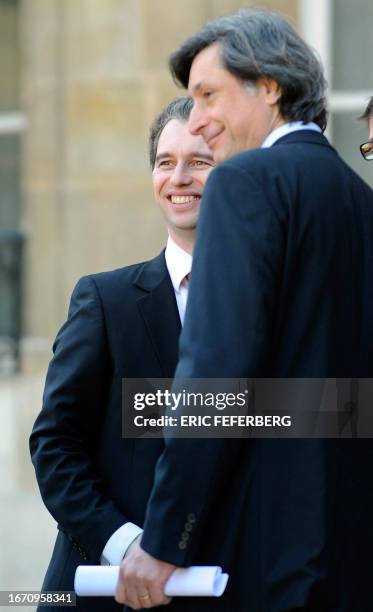 Patrick de Carolis, president of France Televions, , and David Martinon, government spokesman, , leave the Elysee Presidential Palace, on February 19...