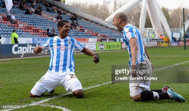 Jermaine Beckford of Huddersfield celebrates with James Vaughan after scoring his second goal during the npower Championship match between...