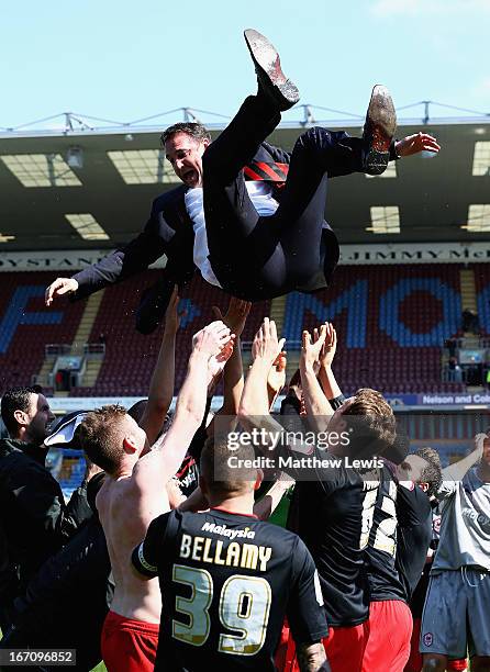 Cardiff city players celebrate going up to the Premiership by throwing their manager Malky MacKay in the air during the npower Championship match...