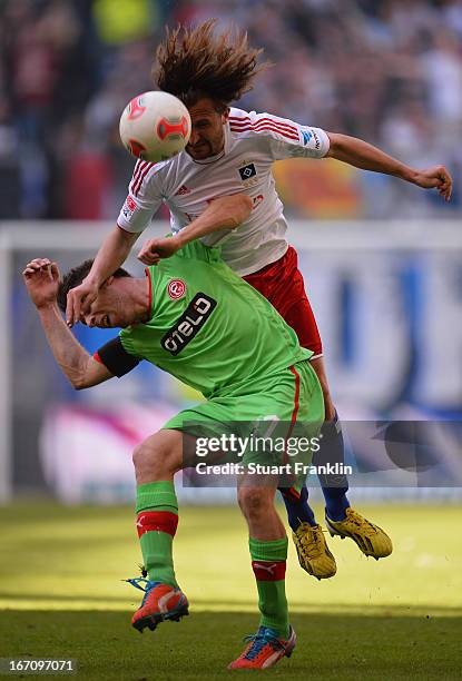 Petr Jiracek of Hamburg is challenged by Andreas Lambertz of Duesseldorf during the Bundesliga match between Hamburger SV and Fortuna Duesseldorf...