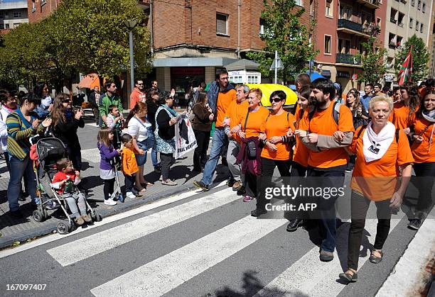 Demonstrators take part in a march against the arrest of eight members of the Basque pro-independence youth organization SEGI in the northern Spanish...