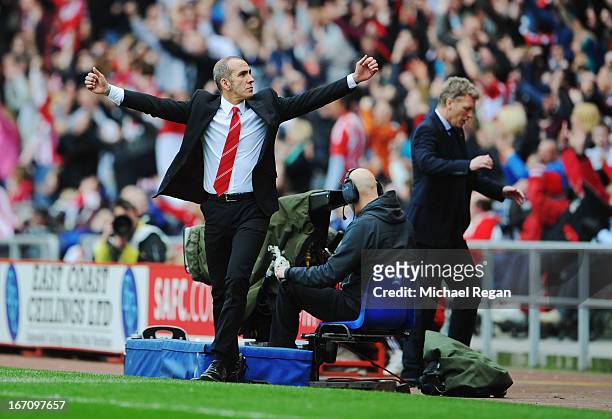 David Moyes manager of Everton reacts as Paolo Di Canio manager of Sunderland celebrates as Stephane Sessegnon scores their first goal during the...