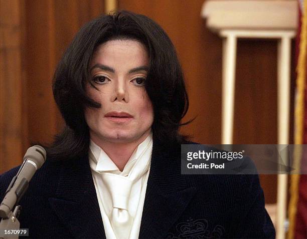 Singer Michael Jackson testifies during his civil trial in Santa Maria Superior Court on December 3, 2002 in Santa Maria, California. The artist is...