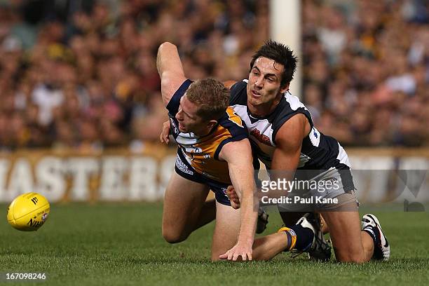 Kane Lucas of the Blues tackles Adam Selwood of the Eagles during the round four AFL match between the West Coast Eagles and the Carlton Blues at...