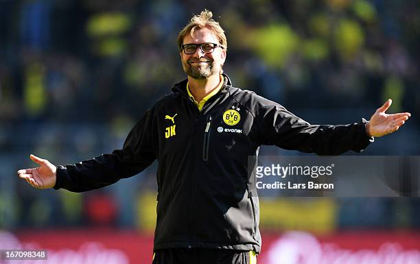 Head coach Juergen Klopp of Dortmund celebrates with the fans of MAinz after winning the Bundesliga match between Borussia Dortmund and 1. FSV Mainz...