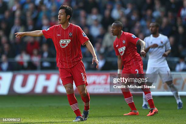 Maya Yoshida of Southampton points the way during the Barclays Premier League match between Swansea City and Southampton at the Liberty Stadium on...