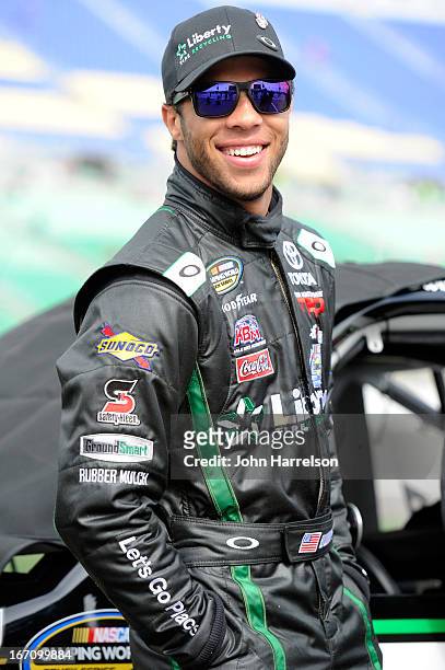 Darrell Wallace Jr., driver of the LibertyTireRecycling/Ground SmartRubber Toyota, walks in the grid during qualifying for the NASCAR Camping World...