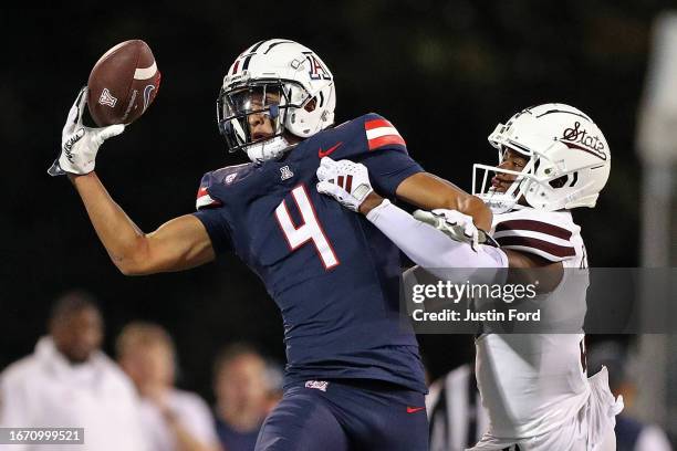 Tetairoa McMillan of the Arizona Wildcats catches a pass against Decamerion Richardson of the Mississippi State Bulldogs during the second half at...