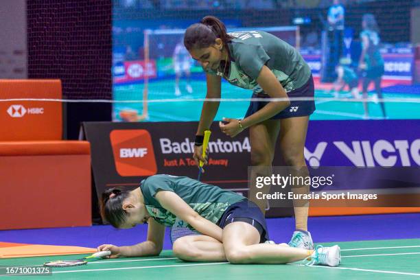 Pearly Tan and Thinaah Muralitharan of Malaysia react in the Women's Doubles final match against Apriyani Rahayu and Siti Fadia Silva Ramadhanti of...