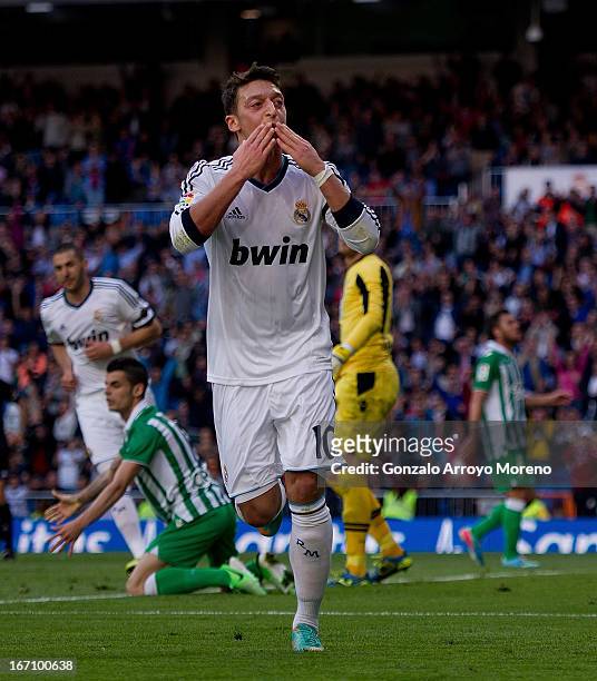 Mesut Ozil of Real Madrid CF celebrates scoring their opening goal during the La Liga match between Real Madrid CF and Real Betis Balompie at...