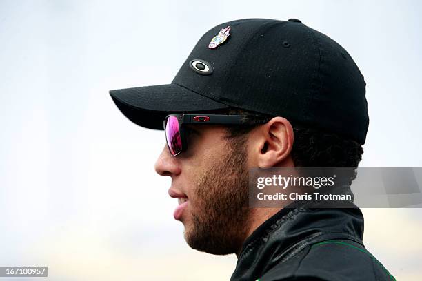 Darrell Wallace Jr., driver of the LibertyTireRecycling/Ground SmartRubber Toyota, stands on the grid during qualifying for the NASCAR Camping World...