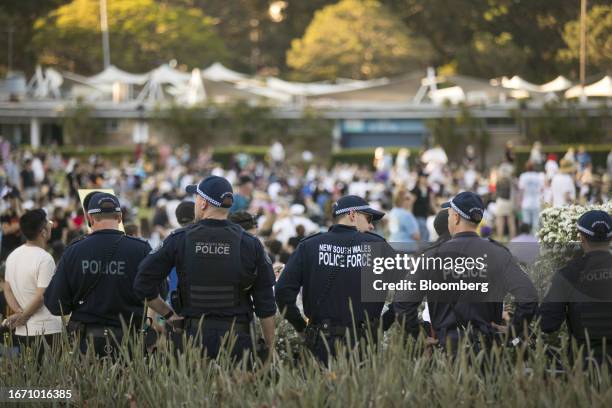Police stand at a rally supporting the Indigenous "Voice to Parliament" in Sydney, Australia, on Sunday, Sept. 17, 2023. Aiming to reduce gross...