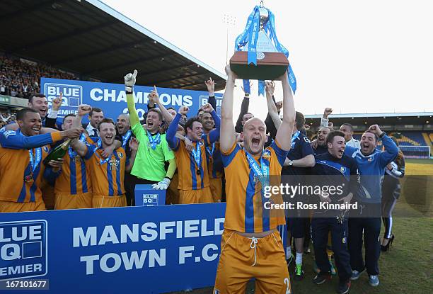 Adam Murray of Mansfield lifts the trophy as Mansfield celebrate after the Blue Square Bet Premier match between Mansfield Town and Wrexham at the...