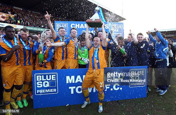 Adam Murray of Mansfield lifts the trophy as Mansfield celebrate after the Blue Square Bet Premier match between Mansfield Town and Wrexham at the...