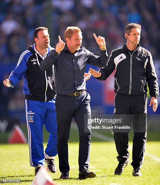 Thorsten Fink, head coach of Hamburg gestures to the fourth official during the Bundesliga match between Hamburger SV and Fortuna Duesseldorf 1895 at...