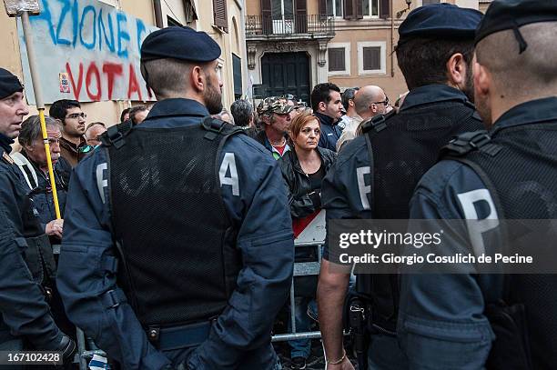 Italian police form a security line as many supporters of Democratic Party and Five Stars Movement take to the street to protest against the...