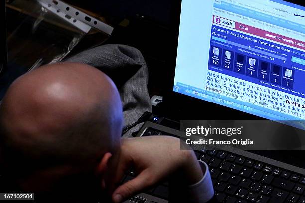 Member of the Italian Parliament checks the results on the internet showing the victory of Giorgio Napolitano after Parliament voted for President of...