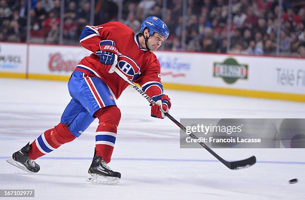 Davis Drewiske of the Montreal Canadiens takes a shot against the Washington Capitals during the NHL game on April 9, 2013 at the Bell Centre in...