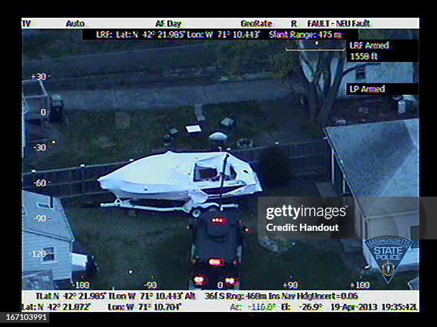 In this handout provided by the Massachusetts State Police, the boat in which Boston Marathon bombing suspect Dzhokhar A. Tsarnaev was hiding is seen...