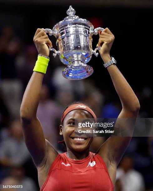 Coco Gauff of the United States celebrates with the trophy after defeating Aryna Sabalenka of Belarus in their Women's Singles Final match on Day...